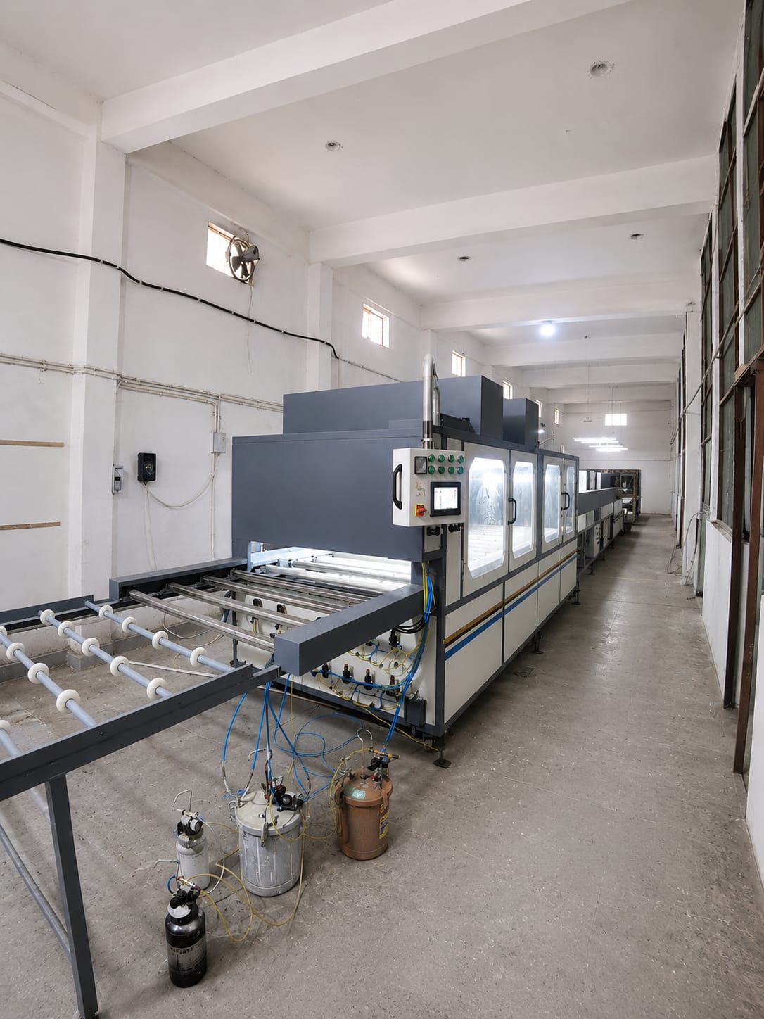 Simsan manufacturing capability — UV coating machine assembly